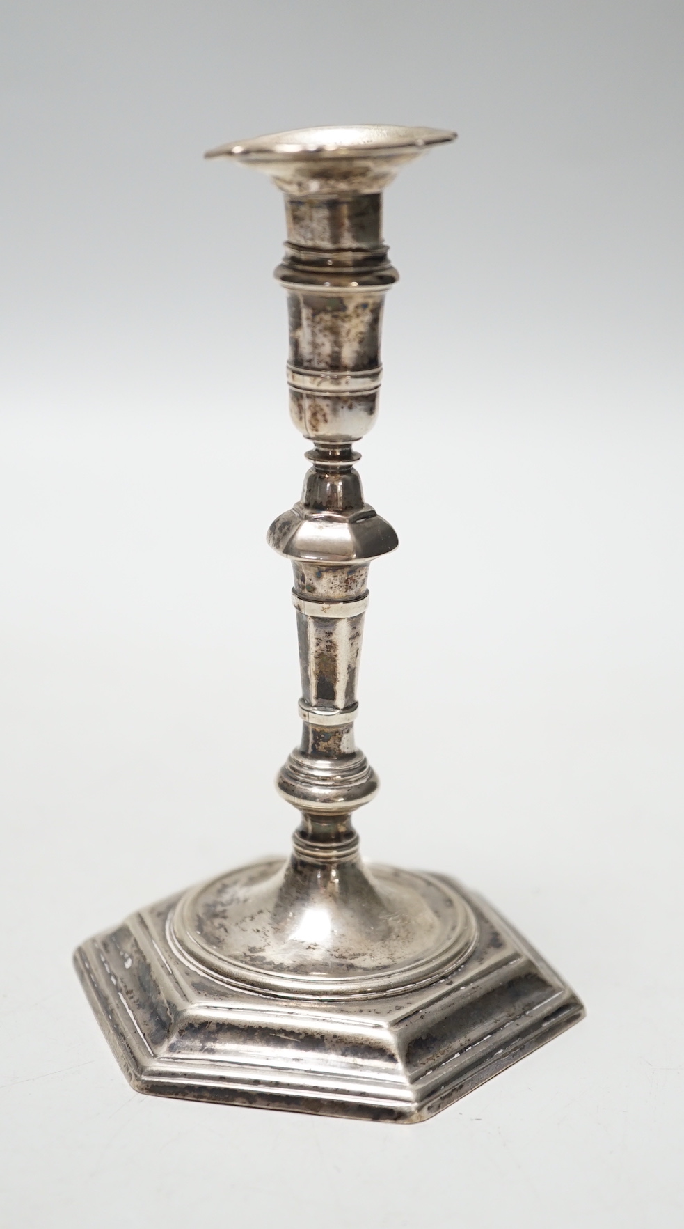 A George II cast silver taper stick, James Gould, London, 1732, 10.8cm, 3oz, with later? unmarked sconce.